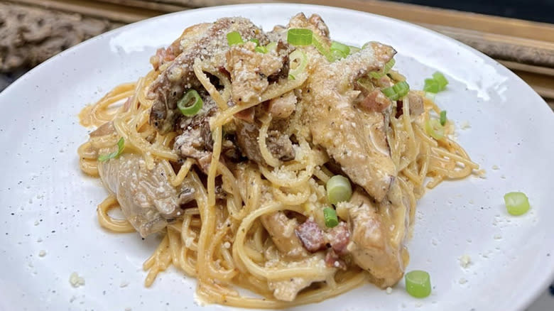 Angel hair pasta with sauce and scallions