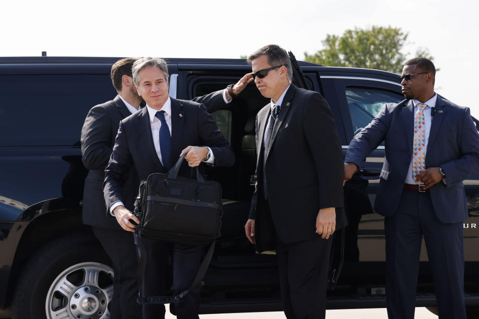 Secretary of State Antony Blinken, left, arrives to board a plane, Monday, July 26, 2021 at Andrews Air Force Base, Md., traveling to New Delhi, India and Kuwait City, Kuwait. (Jonathan Ernst/Pool via AP)