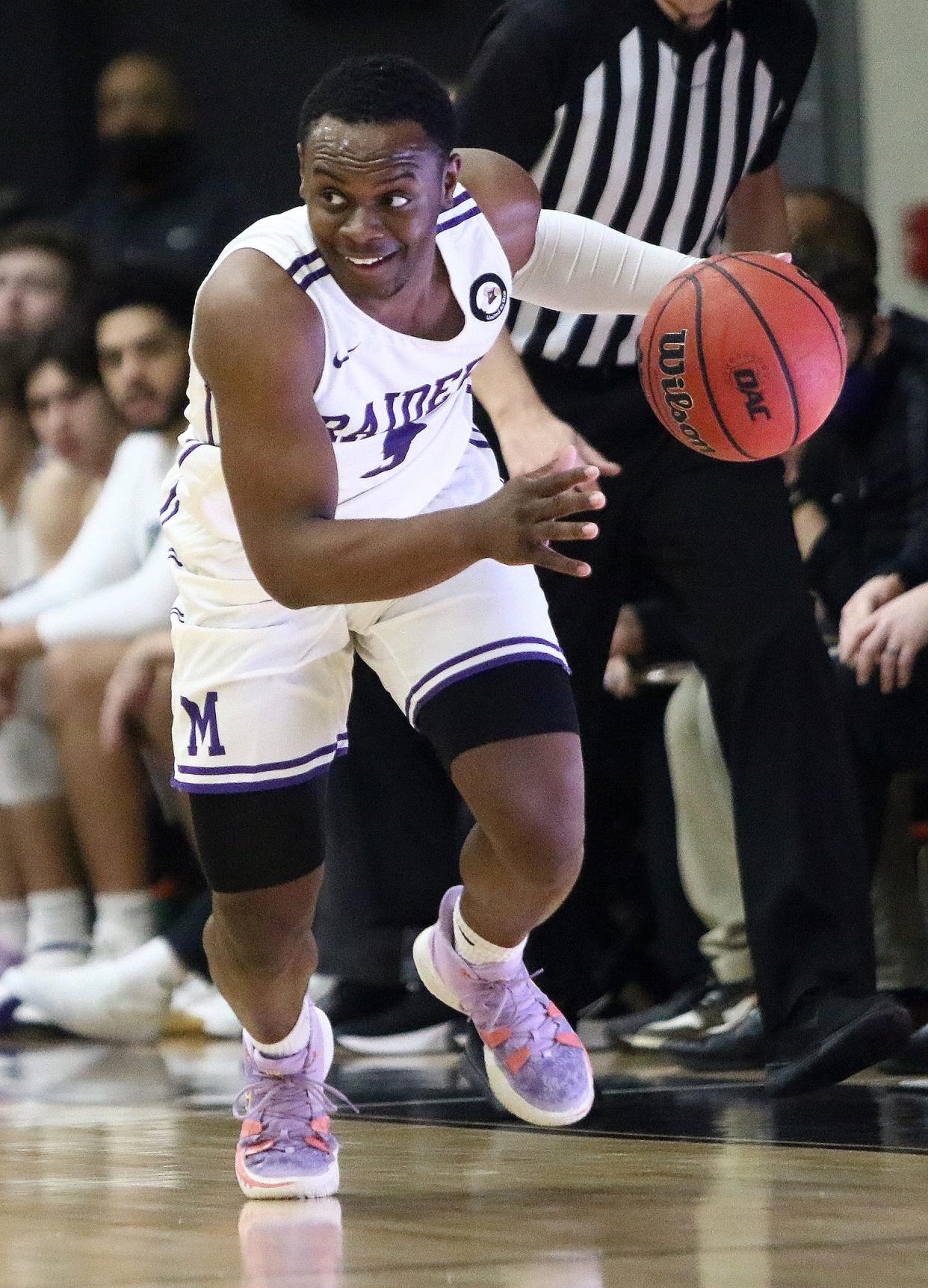 Mount Union's Christ Painter Jr. brings the ball upcourt against Otterbein during OAC action at Mount Union Saturday, January 15, 2022.