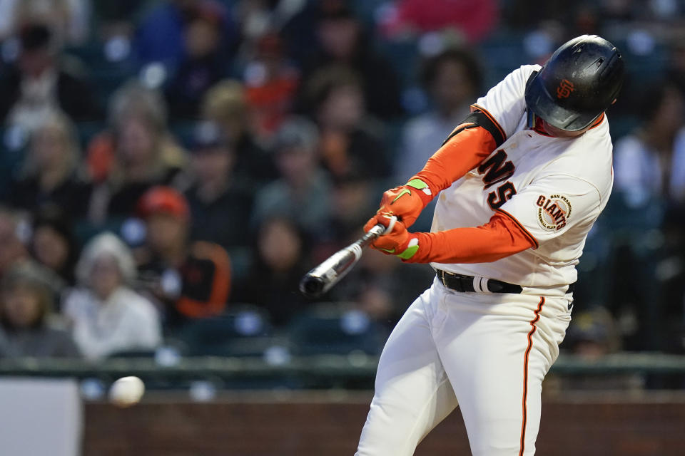 San Francisco Giants' Joc Pederson hits a single against the Colorado Rockies during the first inning of a baseball game in San Francisco, Wednesday, Sept. 28, 2022. (AP Photo/Godofredo A. Vásquez)