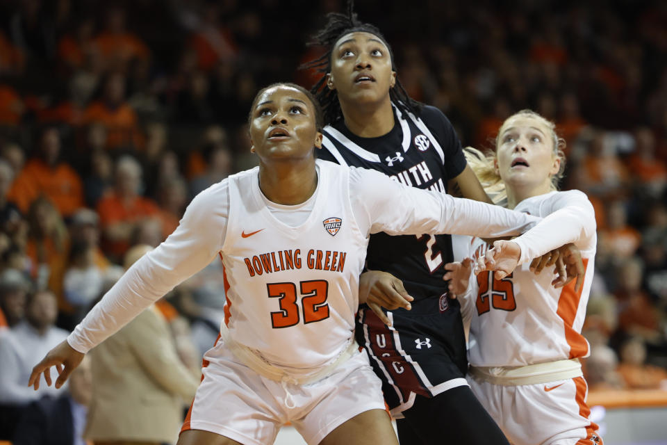 Bowling Green forward Erika Porter (32), South Carolina forward Ashlyn Watkins (2) and Bowling Green guard Lexi Fleming (25) look for a rebound during the first half of an NCAA college basketball game in Bowling Green, Ohio, Tuesday, Dec. 19. 2023. (AP Photo/Rick Osentoski)