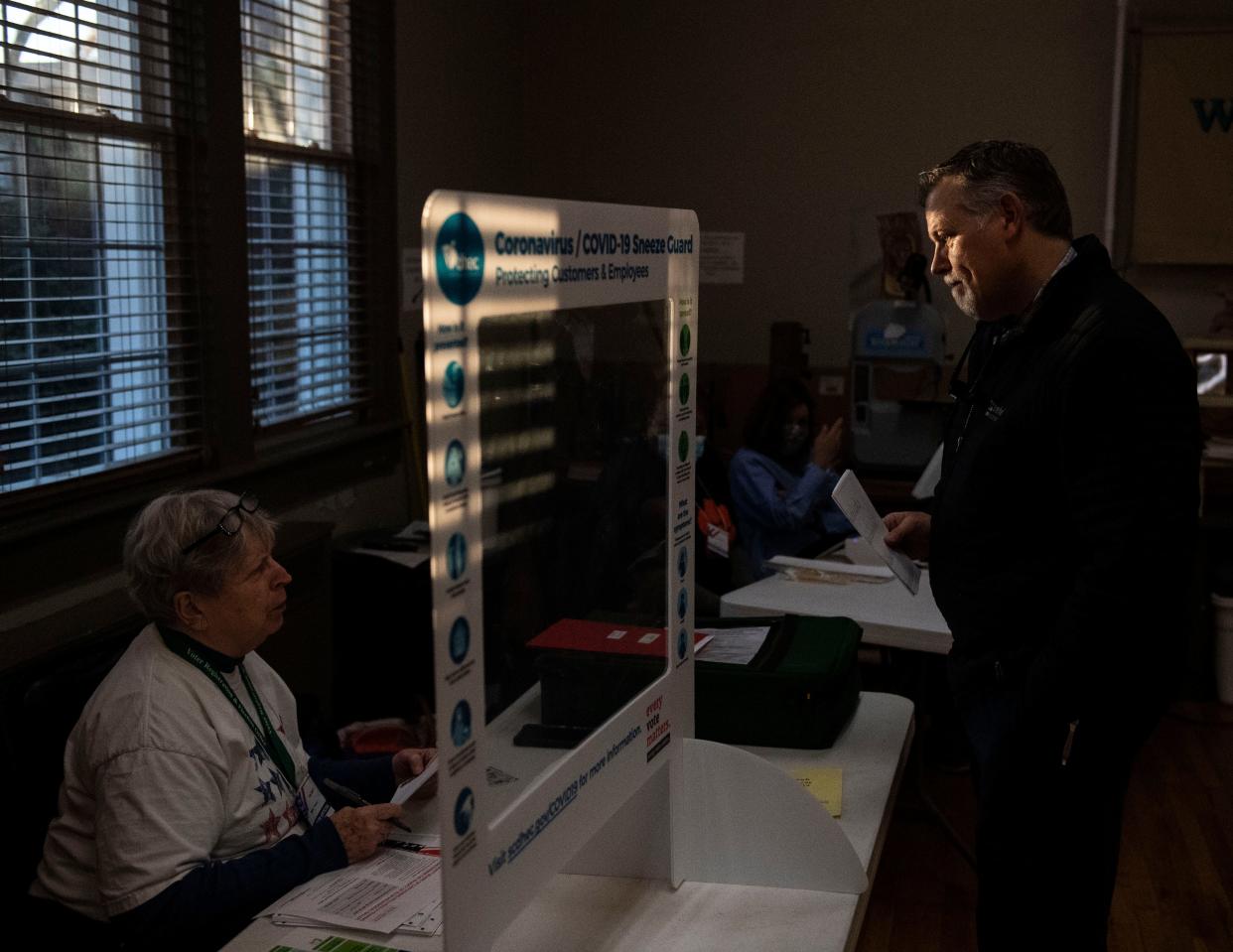 Kevin Greene of Mauldin gets his address changed with the help from Election official, Dee Neff, before casting his vote at Mauldin Cultural Center, in Mauldin, Tuesday, November 16, 2021. Voters hit the polls for the Seat 5 runoff on Mauldin City Council. Incumbent Dale Black faces challenger Frank Allgood, neither of whom had 50% of the vote at the Nov. 2 election.