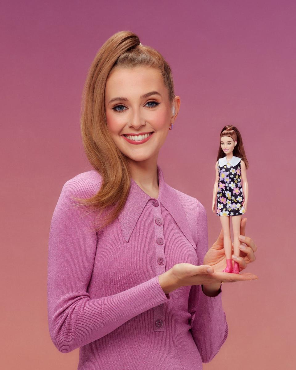 Rose Ayling-Ellis poses with first ever Barbie doll with hearing aids (Mattel)