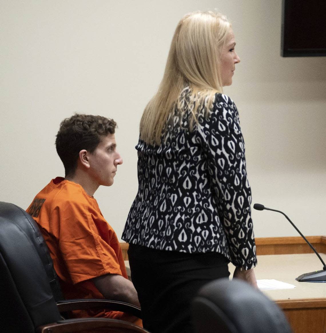 Bryan Kohberger, seated, who is accused of killing four University of Idaho students on Nov. 13, looks on as his attorney, public defender Anne Taylor speaks during a hearing.