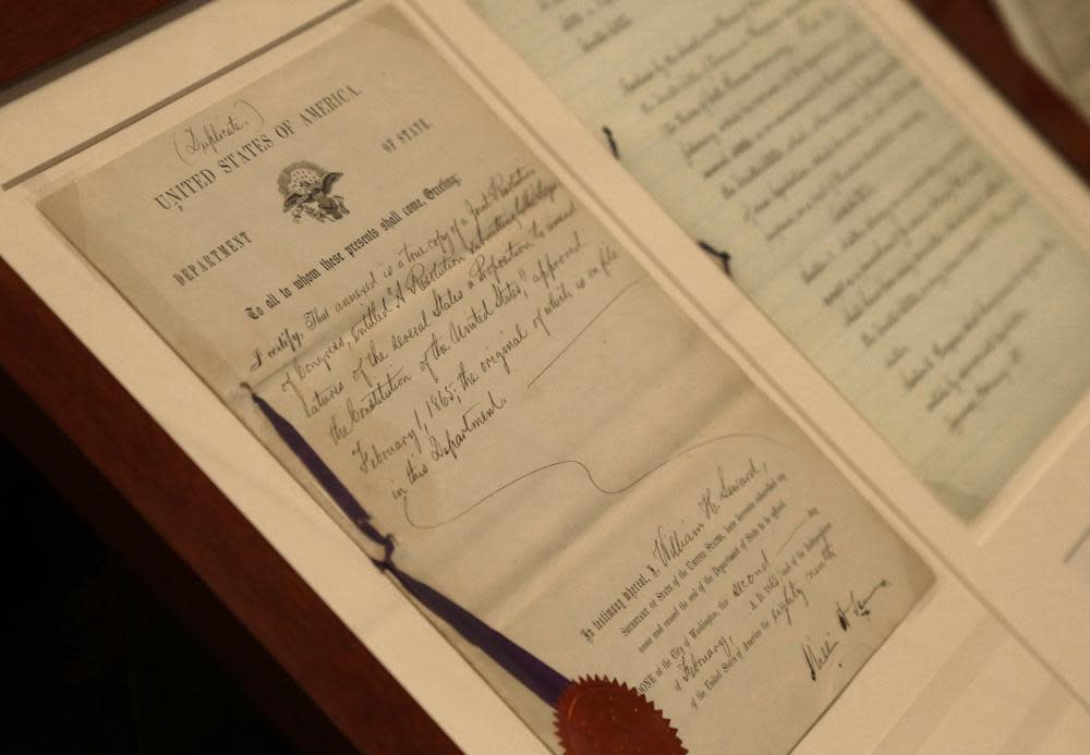 In this Tuesday, June 3, 2014 file photo, a duplicate of the 13th Amendment appears on display at the North Carolina Department of Cultural Resources in Raleigh, N.C. (AP Photo/Gerry Broome)