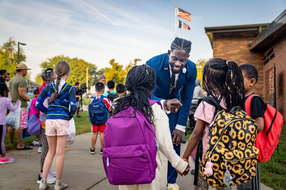 Des Moines Public Schools Superintendent Ian Roberts talks with students before the first day of school at Samuelson Elementary in Des Moines, Wednesday, Aug. 23, 2023.