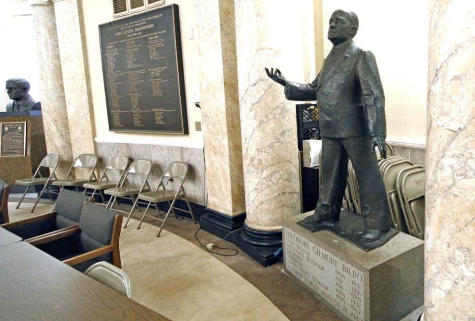 A statue of the late Gov. Theodore Gilmore Bilbo stands out from the back of a first floor conference room at the Capitol Jan. 22, 2009 in Jackson, Miss. (AP Photo/Rogelio V. Solis, File)