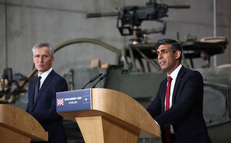 NATO Secretary General Jens Stoltenberg (L) and UK Prime Minister Rishi Sunak attend a joint press conference at the Warsaw Armoured Brigade in Warsaw during Sunak's visit to Poland. Henry Nicholls/PA Wire/dpa