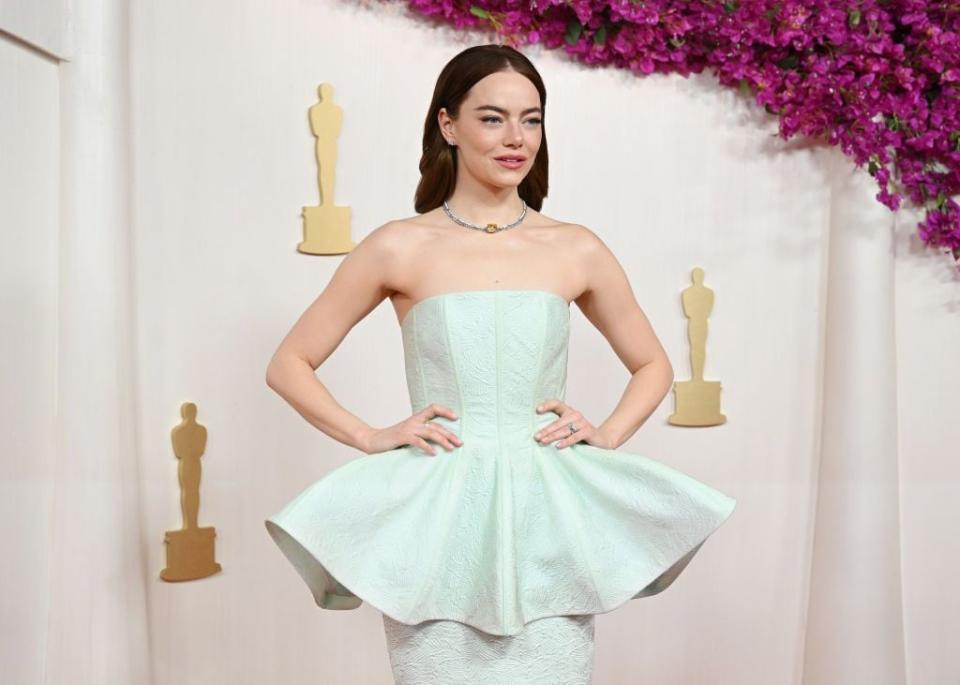 Emma Stone arrives at the 96th Academy Awards.