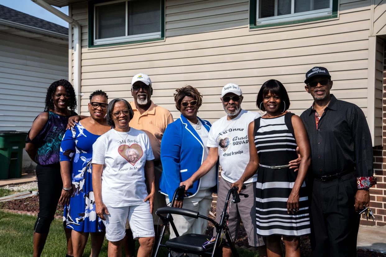 From left: Johnnetta Long, Rachelle Long, Gerry Page, Valerie James, Vicky Long Hill, Gregory Long Sr., Margaret Long and Stephen Long stand for a photo outside their parents' home in Valley Junction on Tuesday, June 27, 2023, in West Des Moines. The family worked to designate a street in Valley Junction after longtime residents John and Barbara Long.