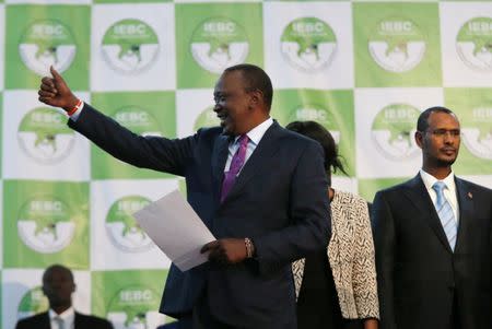 Incumbent President Uhuru Kenyatta reacts after he was announced winner of the presidential election at the IEBC National Tallying centre at the Bomas of Kenya, in Nairobi, Kenya August 11, 2017. REUTERS/Thomas Mukoya