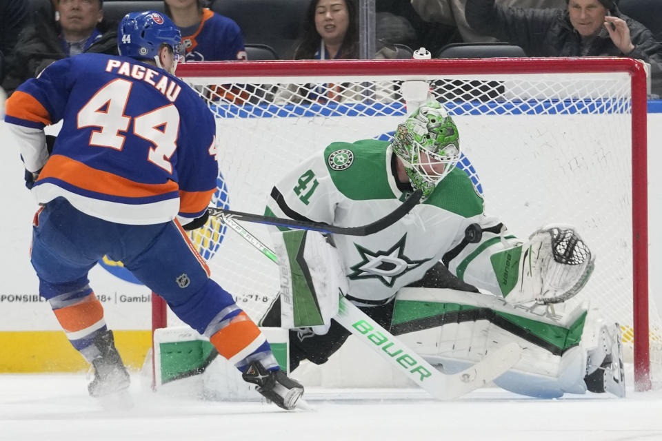 Dallas Stars goaltender Scott Wedgewood (41) makes the save against New York Islanders center Jean-Gabriel Pageau (44) during the first period of an NHL hockey game Sunday, Jan. 21, 2024, in Elmont, N.Y. (AP Photo/Mary Altaffer)