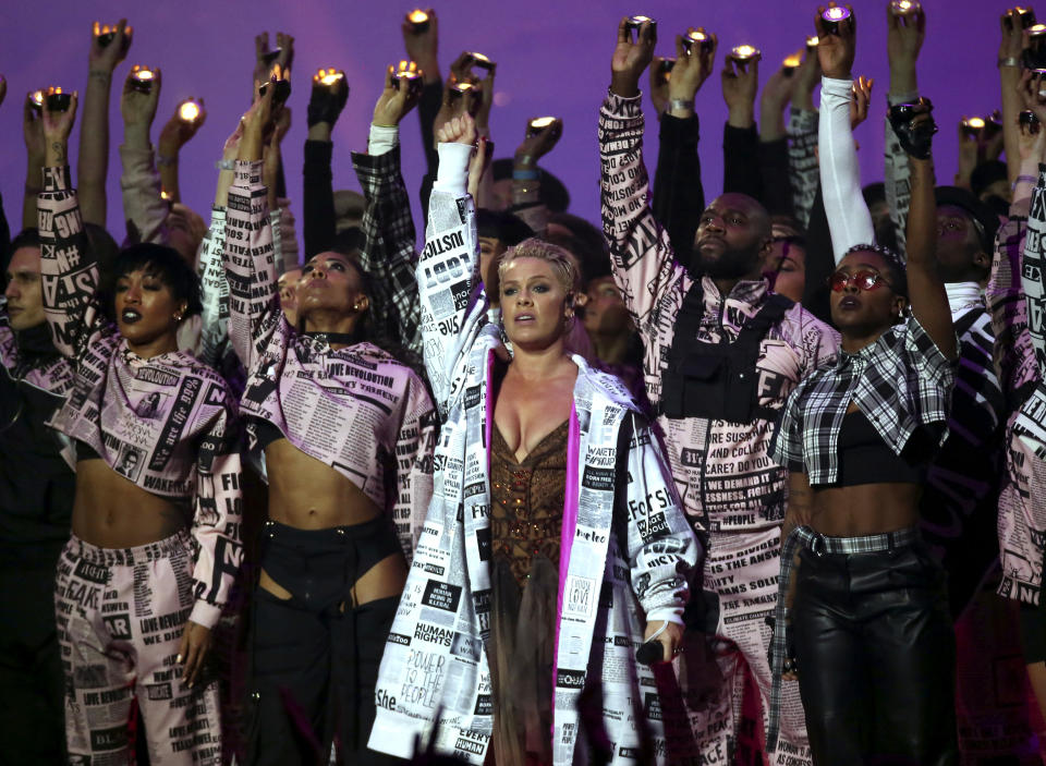 FILE - Pink, center, performs onstage at the Brit Awards on Feb. 20, 2019 in London. Pink turns 41 on Sept. 8, 2020. (Photo by Joel C Ryan/Invision/AP, File)