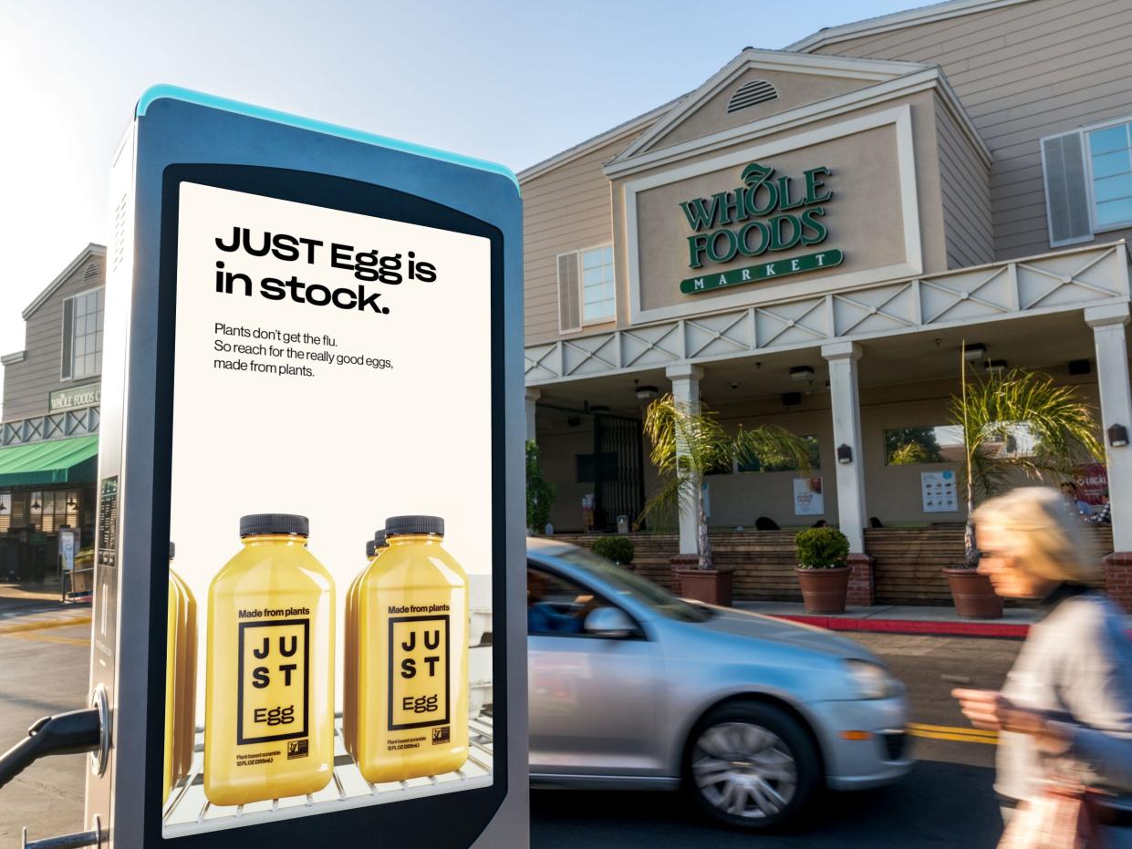 A Just Egg advertisement in front of a Whole Foods