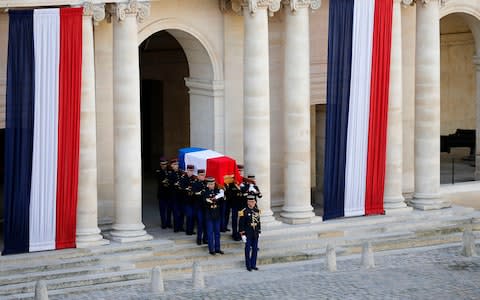 Honor guards carry the flag-drapped coffin of late French President Jacques Chirac  - Credit: Chesnot/Getty Images