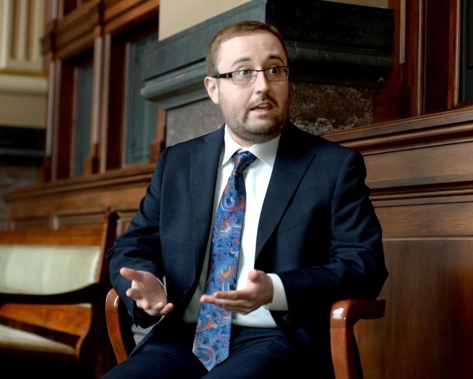 GOP candidate in IL-13 Thomas Clatterbuck answers a reporter's questions at the Illinois state Capitol Friday, January 26, 2024.