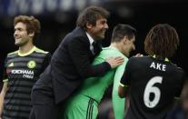 Britain Football Soccer - Everton v Chelsea - Premier League - Goodison Park - 30/4/17 Chelsea manager Antonio Conte celebrates after the match with Thibaut Courtois Reuters / Phil Noble Livepic