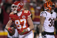 Kansas City Chiefs tight end Travis Kelce (87) catches a touchdown pass in front of Cincinnati Bengals safety Jessie Bates III (30) during the first half of the NFL AFC Championship playoff football game, Sunday, Jan. 29, 2023, in Kansas City, Mo. (AP Photo/Jeff Roberson)