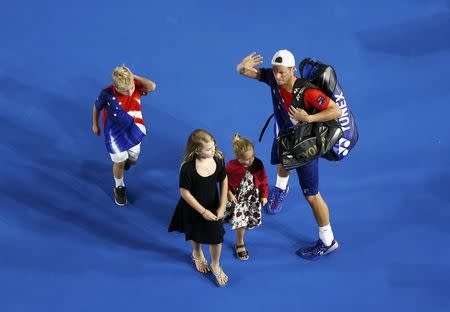 Australia's Lleyton Hewitt leaves with his children after playing his final Australian Open singles match before his retirement, at the Australian Open tennis tournament at Melbourne Park, Australia, January 21, 2016. REUTERS/Jason O'Brien