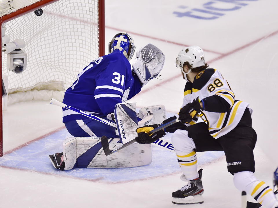 Boston Bruins right wing David Pastrnak (88) scores on Toronto Maple Leafs goaltender Frederik Andersen (31) during the second period of Game 4 of an NHL hockey first-round playoff series Wednesday, April 17, 2019, in Toronto. (Frank Gunn/The Canadian Press via AP)