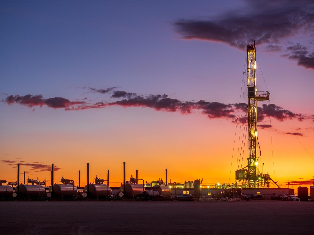 A rig drills a well at a Delaware Basin location for WPX Energy. Oil and gas activity has rebounded some throughout the state, but there are questions about how far the industry can soar.