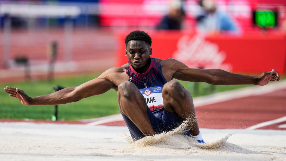 Salif Mane lands while competing (Charlie Neibergall / AP)