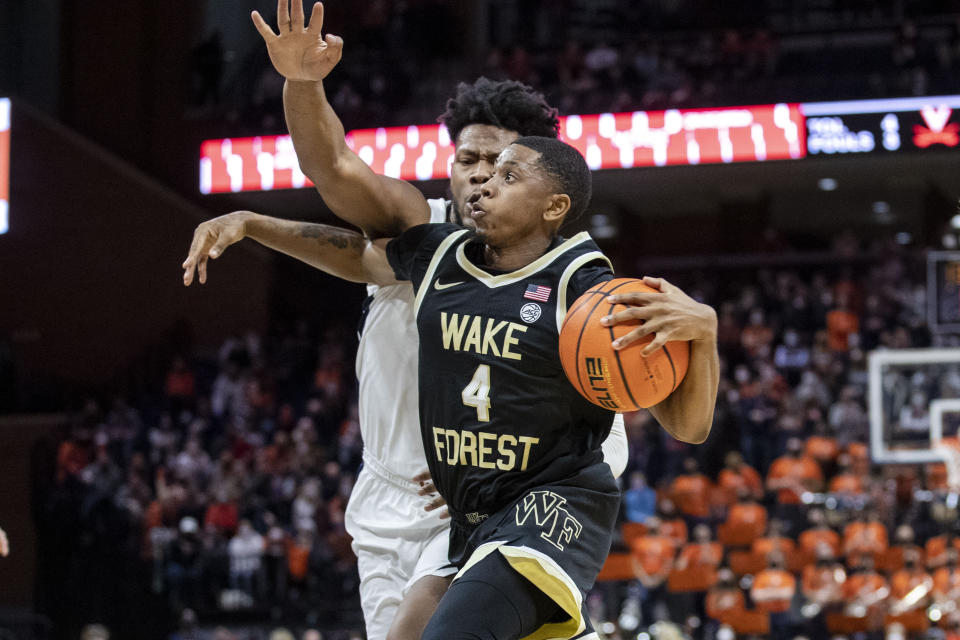 FILE - Wake Forest guard Daivien Williamson (4) drives during the first half of the team's NCAA college basketball game against Virginia in Charlottesville, Va., Jan. 15, 2022. Williamson is the top returning scorer and the lone returning starter. (AP Photo/Erin Edgerton, File)