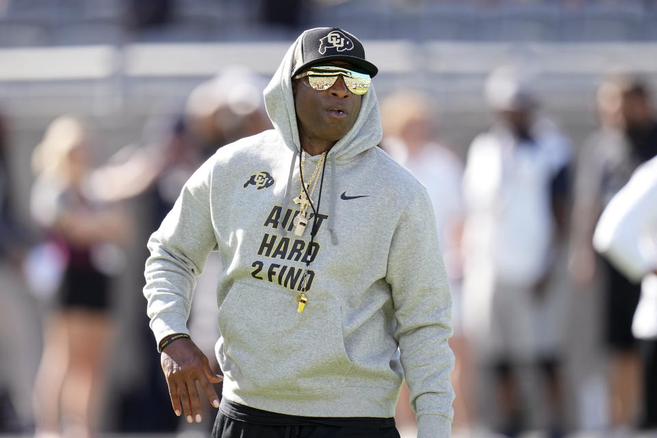 Colorado head coach Deion Sanders pauses on the field prior to an NCAA college football game against Arizona State Saturday, Oct. 7, 2023, in Tempe, Ariz. (AP Photo/Ross D. Franklin)