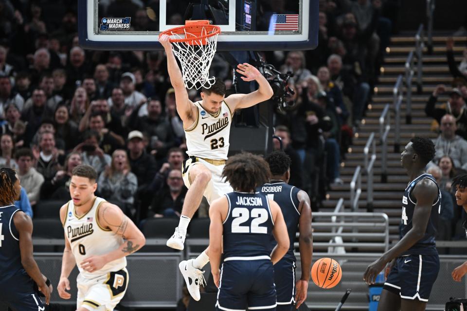 Second round: Purdue's Camden Heide dunks the ball against Utah State.