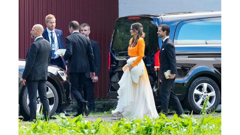 Princess Sofia wearing orange and white gown