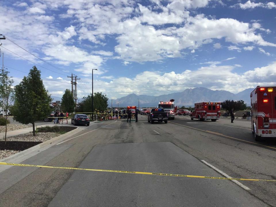 Police investigate the scene where a pilot died in a small plane crash Wednesday, on Copper Hills Parkway between 7800 South and Airport Road, just west of South Valley Airport in West Jordan.