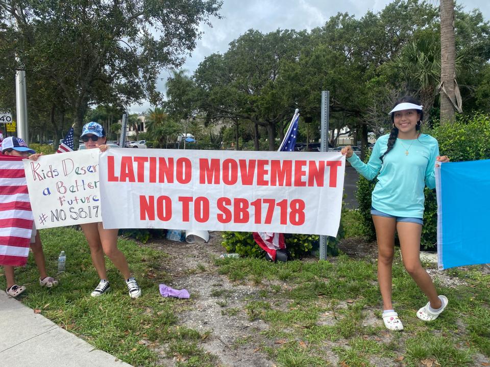 Demonstrators in Jupiter protest a new Florida immigration law Saturday June 24, 2023.