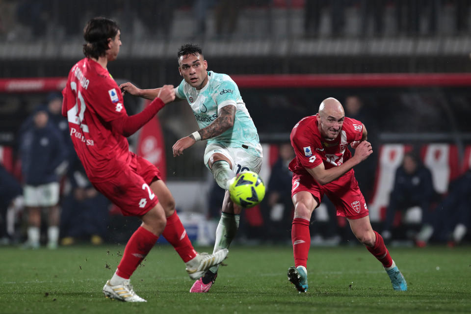 MONZA, ITALY - JANUARY 07: Lautaro Martinez of FC Internazionale shoots under pressure from Filippo Ranocchia and Luca Caldirola of AC Monza during the Serie A match between AC Monza and FC Internazionale at Stadio Brianteo on January 07, 2023 in Monza, Italy. (Photo by Emilio Andreoli/Getty Images)