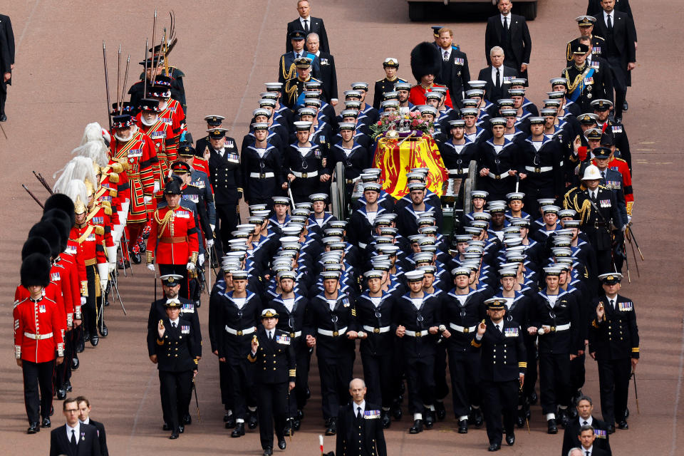 The Queen's cortege borne on the State Gun Carriage of the Royal Navy travels along The Mall with the Gentlemen at Arms during her state funeral in London