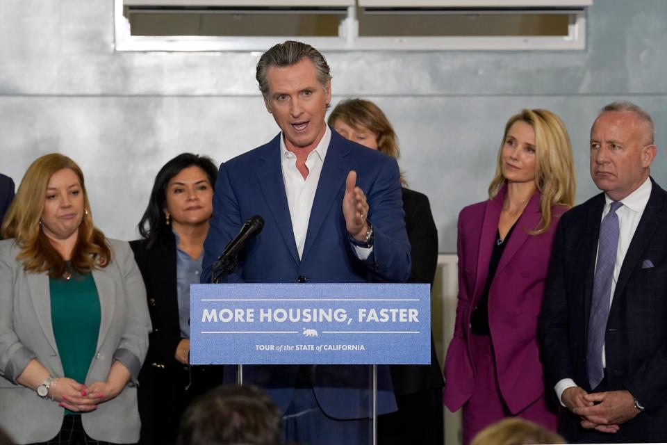 California Gov. Gavin Newsom announces a proposal to build 1,200 small homes across the state to reduce homelessness in Sacramento Calif., on March 16, 2023. Newsom signed two laws on Wednesday, Oct. 11, 2023, to fast-track low-income housing on surplus land owned by nonprofit colleges and religious institutions and to streamline the housing permitting process.