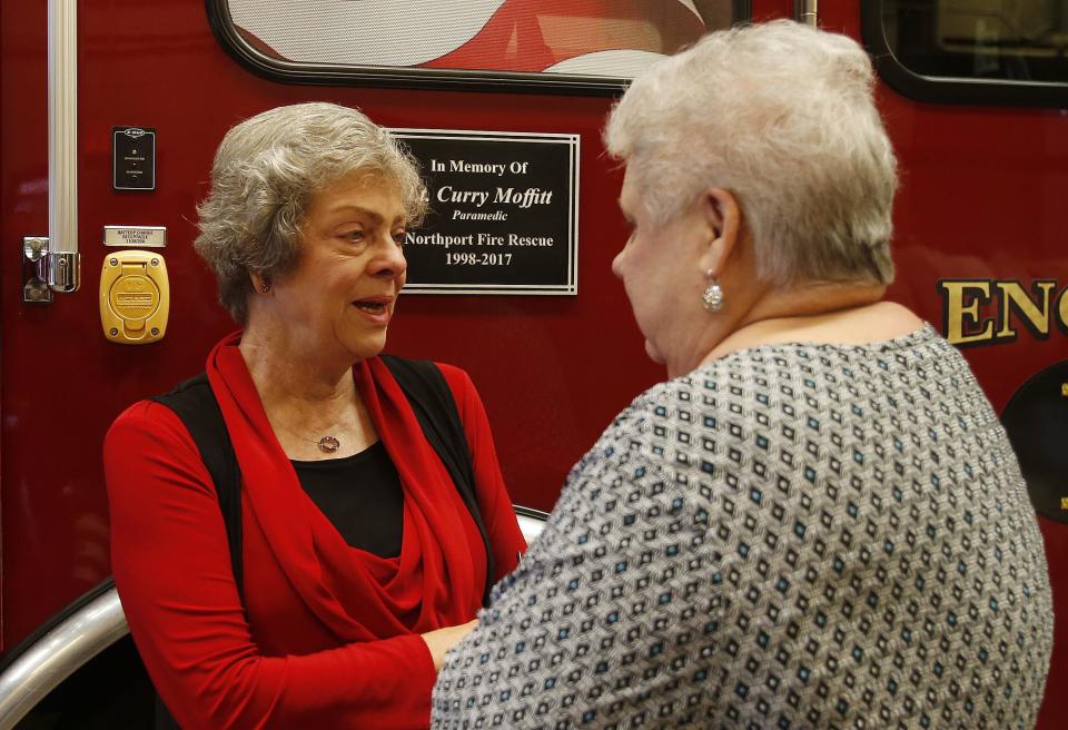 Northport Mayor Donna Aaron speaks with Nancy Moffitt during a dedication of Engine 1 in memory of Moffitt's son, Lt. Curry Moffitt, at Northport Fire Station No. 1 on Monday, Sept. 11, 2017.