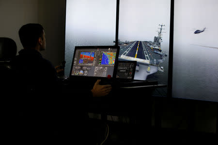 Military helicopter pilot Henery Jacobs uses a fixed wing flight simulator at Coast Flight Training in San Diego, California, U.S., January 15, 2019. Picture taken January 15, 2019. REUTERS/Mike Blake