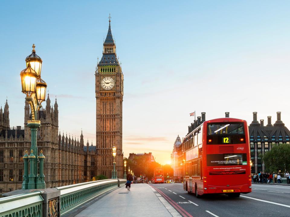 London Big Ben and traffic on Westminster Bridge - stock photo