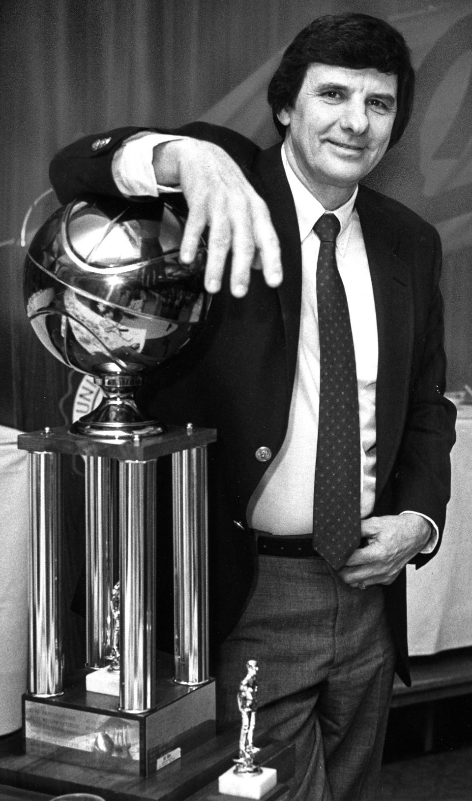 The late Jack Greynolds Sr. become accustomed to receiving coach of the year awards at the helm of the Barberton High School boys basketball program. Greynolds is pictured with a trophy in 1984.