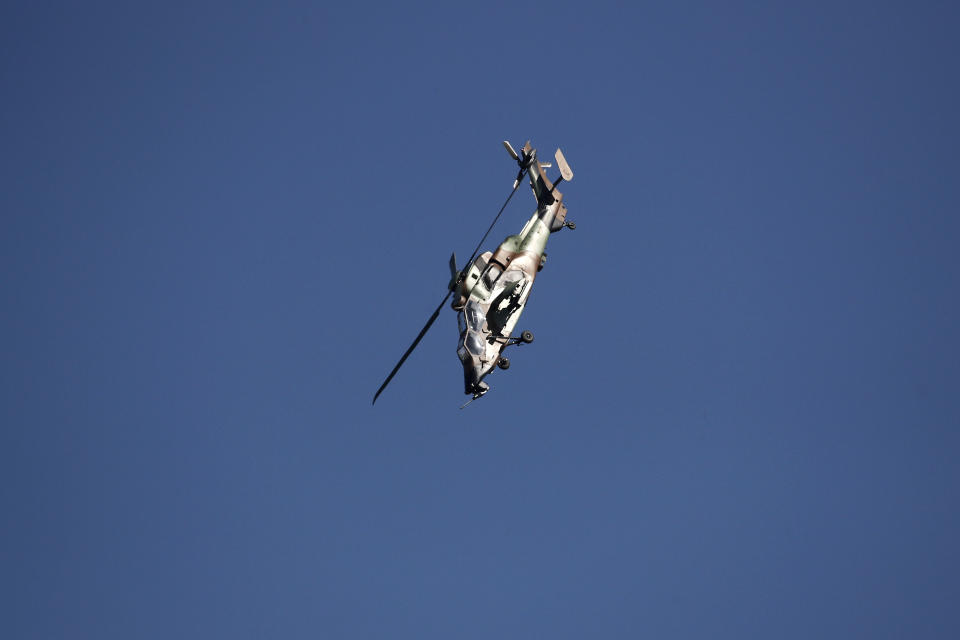 A French Army Eurocopter Tiger helicopter performs during the inauguration the 53rd International Paris Air Show at Le Bourget Airport near Paris, France, Monday June 17, 2019. The world's aviation elite are gathering at the Paris Air Show with safety concerns on many minds after two crashes of the popular Boeing 737 Max. (Benoit Tessier/Pool via AP)