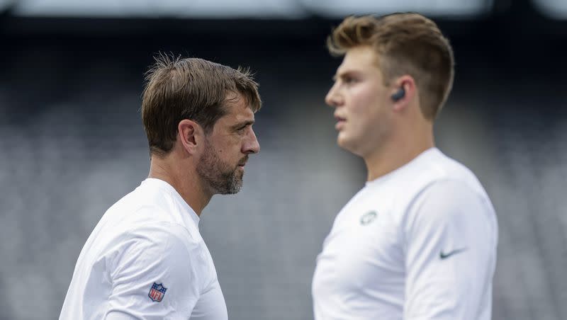 New York Jets quarterbacks Aaron Rodgers, left, and Zach Wilson practice before a preseason game against the New York Giants on Aug. 26, 2023, in East Rutherford, N.J.
