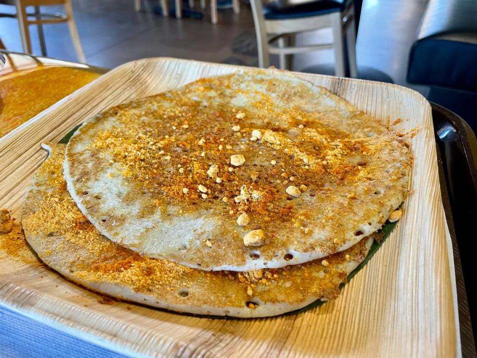 Mylapore South Indian Vegetarian makes a variety of uthappam, including one topped with a spice powder called podi.