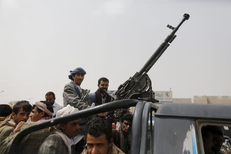 Houthi fighters ride a patrol truck outside Sanaa Airport March 28, 2015. REUTERS/Khaled Abdullah