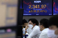 A currency trader watches monitors at the foreign exchange dealing room of the KEB Hana Bank headquarters in Seoul, South Korea, Wednesday, Sept. 23, 2020. Asian markets were mostly lower on Wednesday as investors kept a wary eye on how the coronavirus pandemic will affect the economic outlook.(AP Photo/Ahn Young-joon)