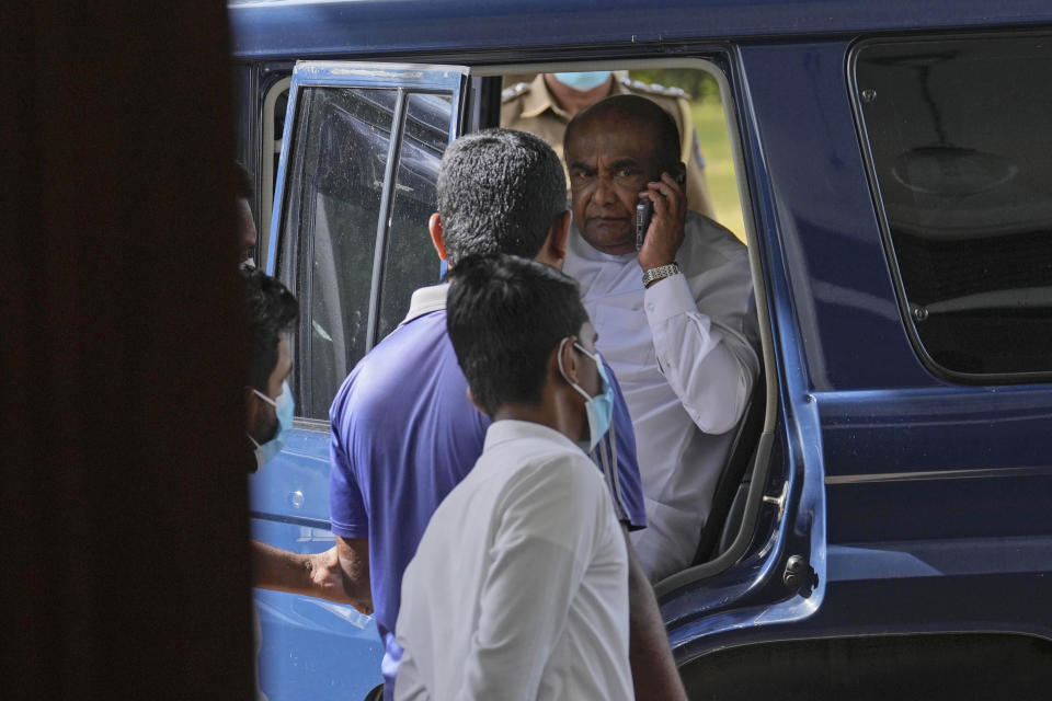 Sri Lanka's Parliament Speaker Mahinda Yapa Abeywardana sarrives to address a press conference in Colombo, Sri Lanka, Friday, July 15, 2022. Abeywardana says President Gotabaya Rajapaksa has resigned and Parliament will convene to choose a new leader after massive protests took over government buildings to force him out of office. (AP Photo/Rafiq Maqbool)