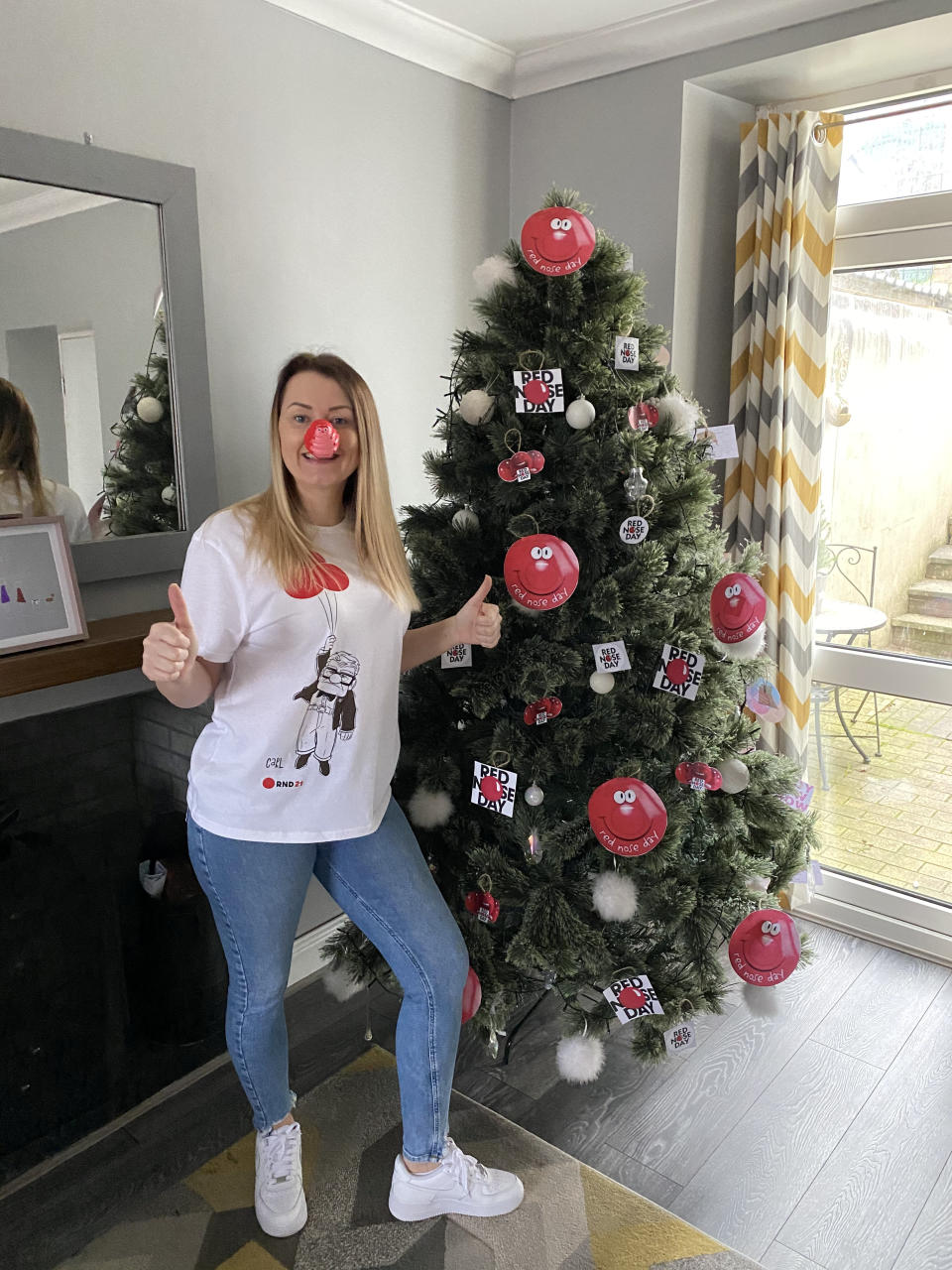 Christmas-loving Victoria Gauden found her twinkly festive lights so uplifting last Christmas she kept the tree up all year and redecorated it around 140 times. (SWNS)