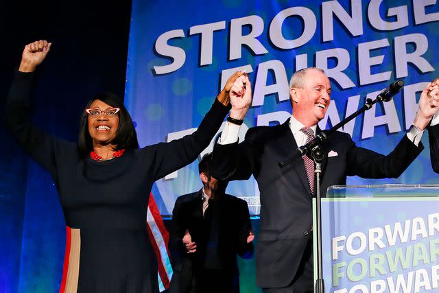 <p>AP Photo/Noah K. Murray</p> New Jersey Lt. Gov. Sheila Oliver and New Jersey Gov. Phil Murphy celebrate their reelection on Nov. 3, 2021