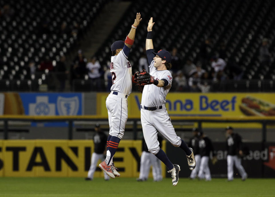 Francisco Lindor, left, celebrates with Tyler Naquin after the Indians won their 15th straight game. (AP)