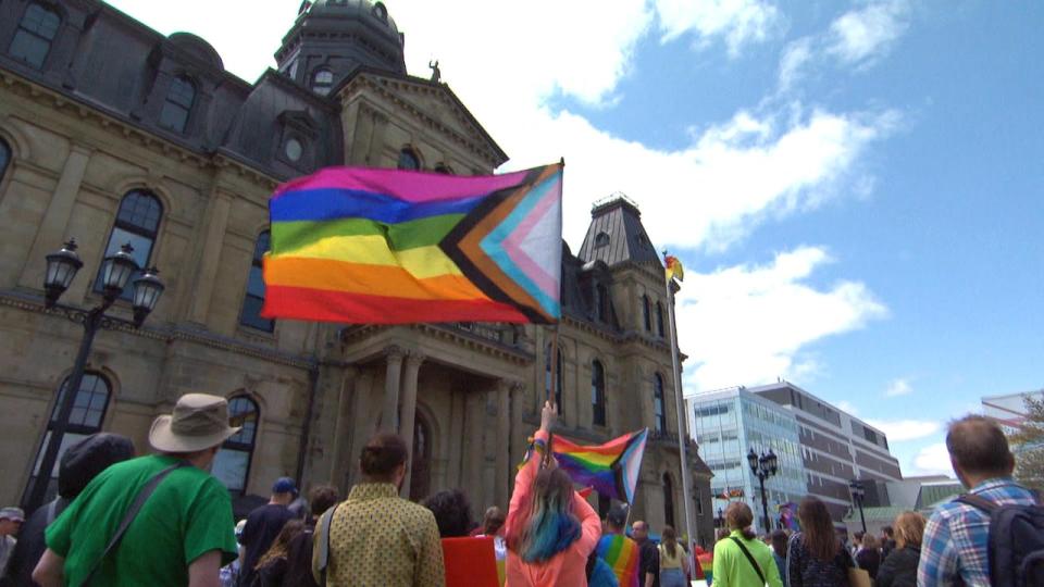 Opponents of the review of Policy 713 demostrate outside the New Brunswick legislature.