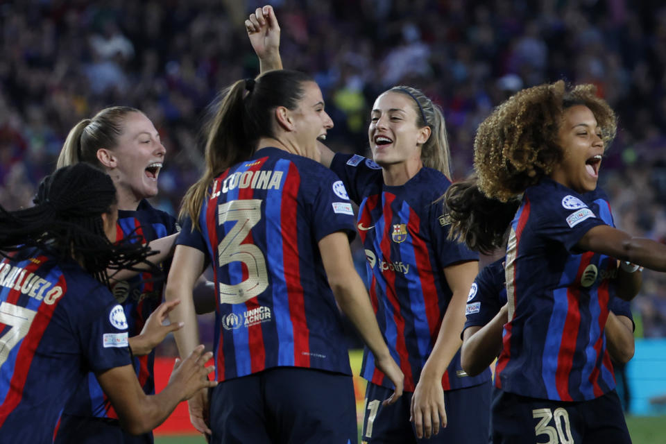 Barcelona's Alexia Putellas, background center, celebrates with her teammates at the end of the Women's Champions League semifinal, second leg, soccer match between FC Barcelona and Chelsea FC at the Camp Nou stadium in Barcelona, Spain, Thursday, April 27, 2023. The match ended in a 1-1 draw but Barcelona advance on a 2-1 aggregate. (AP Photo/Joan Monfort)